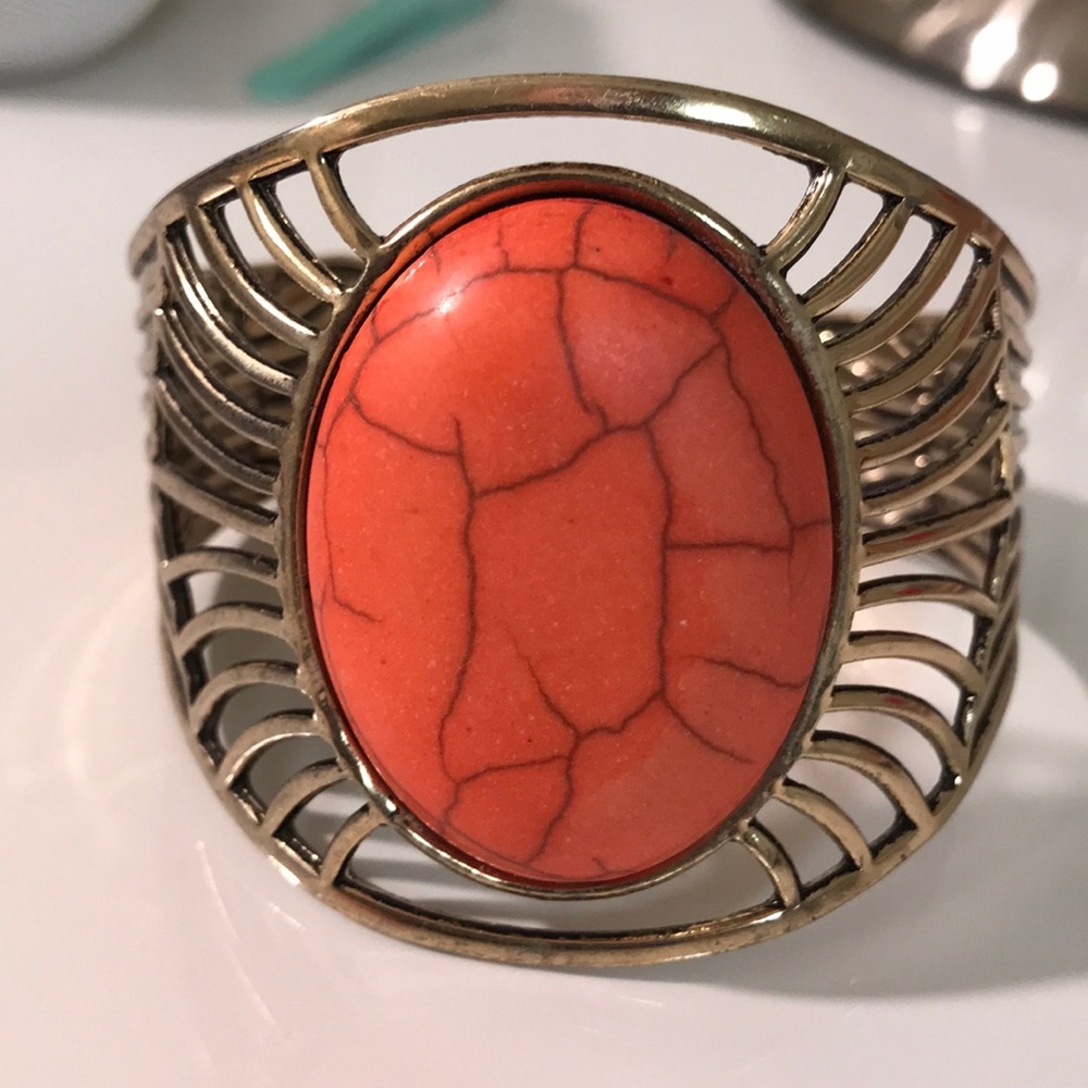 Gold cuff with coral stone